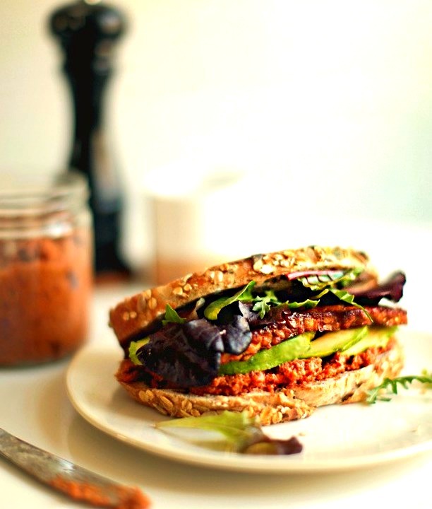 A smoky tempeh sandwich with sundried tomato pesto looks absolutely delicious.